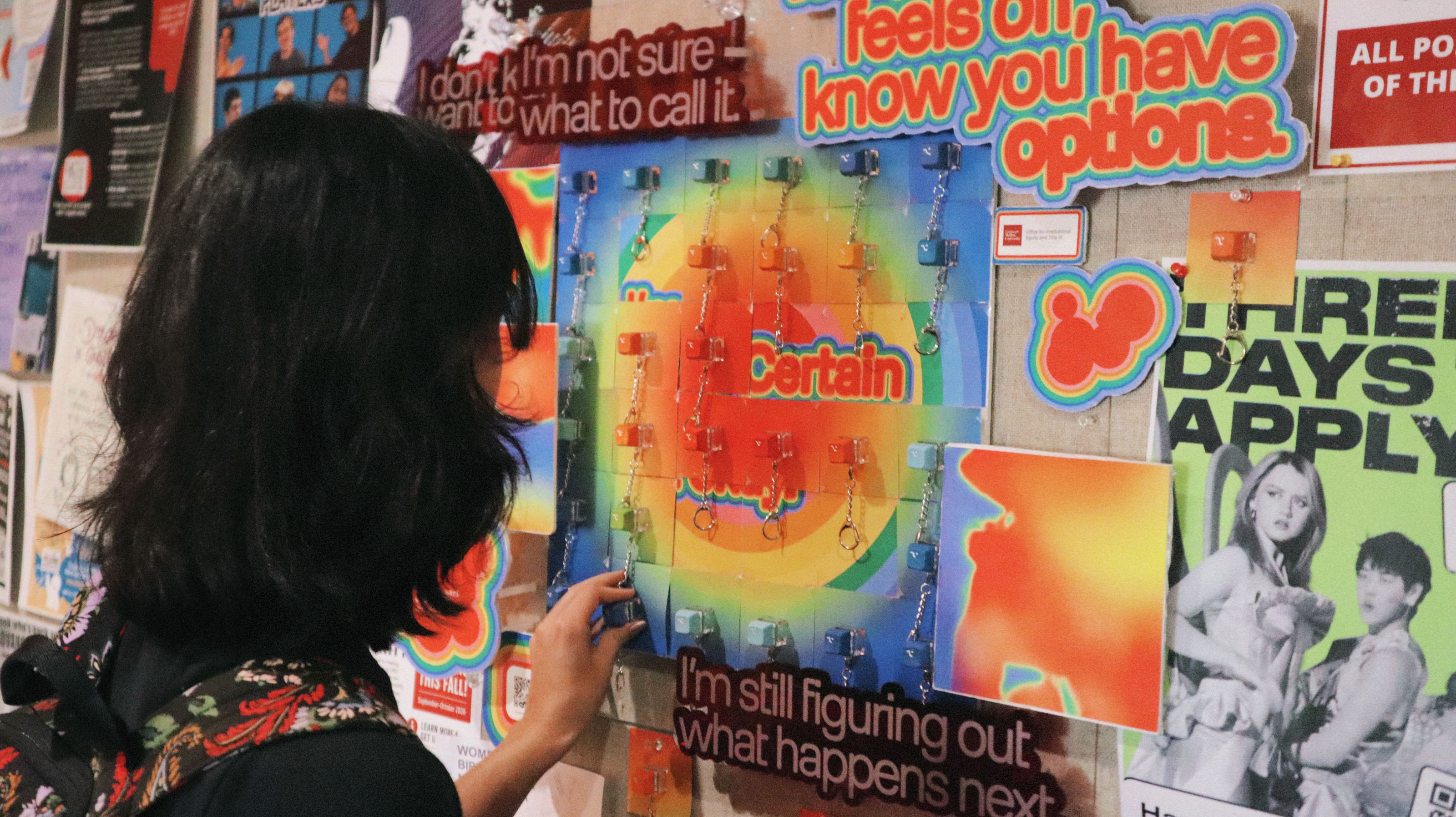 A visitor reaching for an Option key on the installation